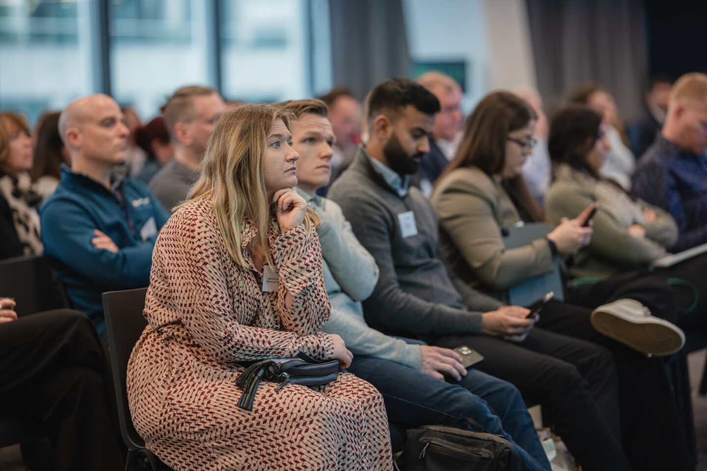 A room full of delegates listening to a presentation.