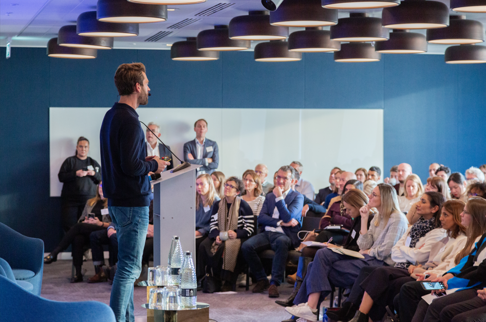 Speaker presenting to delegates at a future of work conference