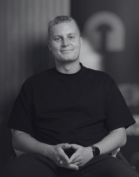 A young man with short blonde hair.