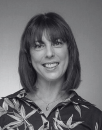 A business woman with shoulder length brown hair