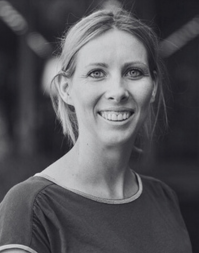 A headshot of a blonde-haired woman.