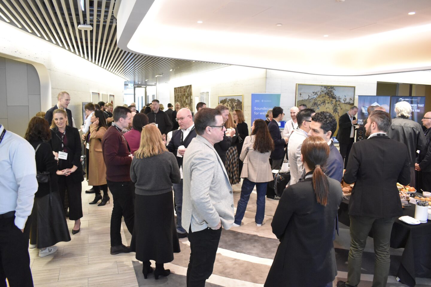 A group of delegates networking at WORKTECH Sydney, 2026, the premiere future of work and the workplace conference in Australia